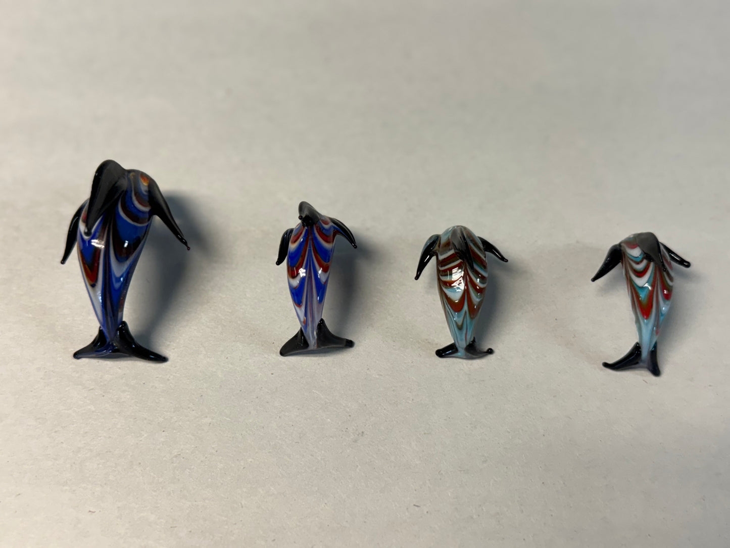 Set of Four Hand-Blown Miniature Art Glass Dolphins