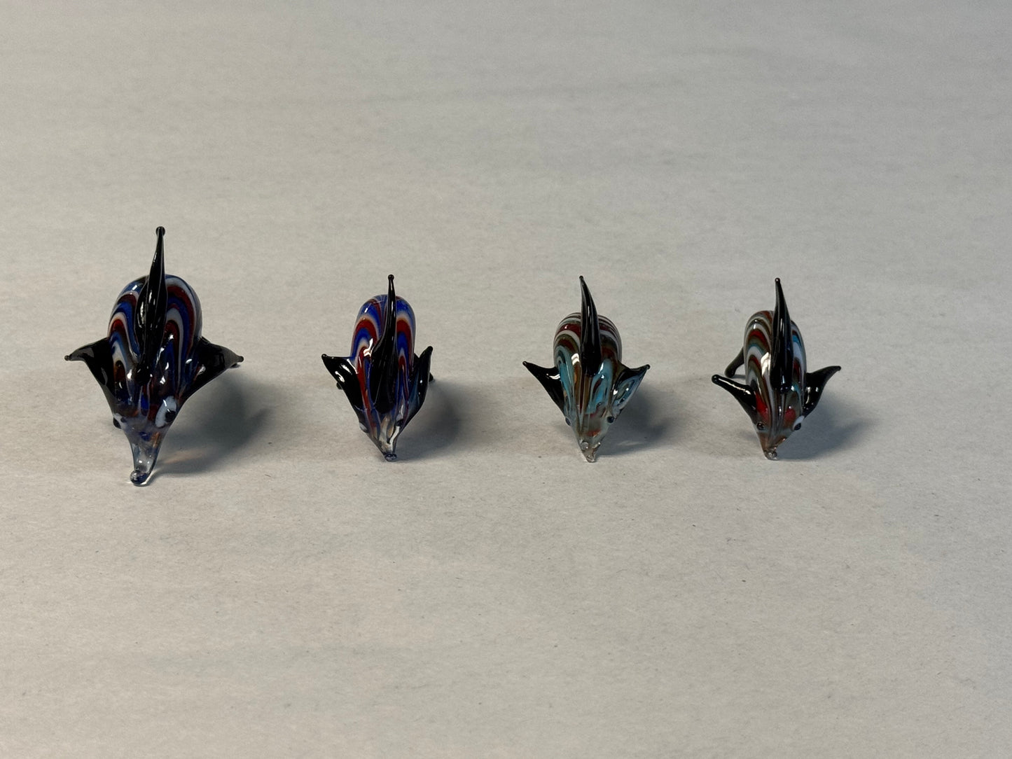 Set of Four Hand-Blown Miniature Art Glass Dolphins