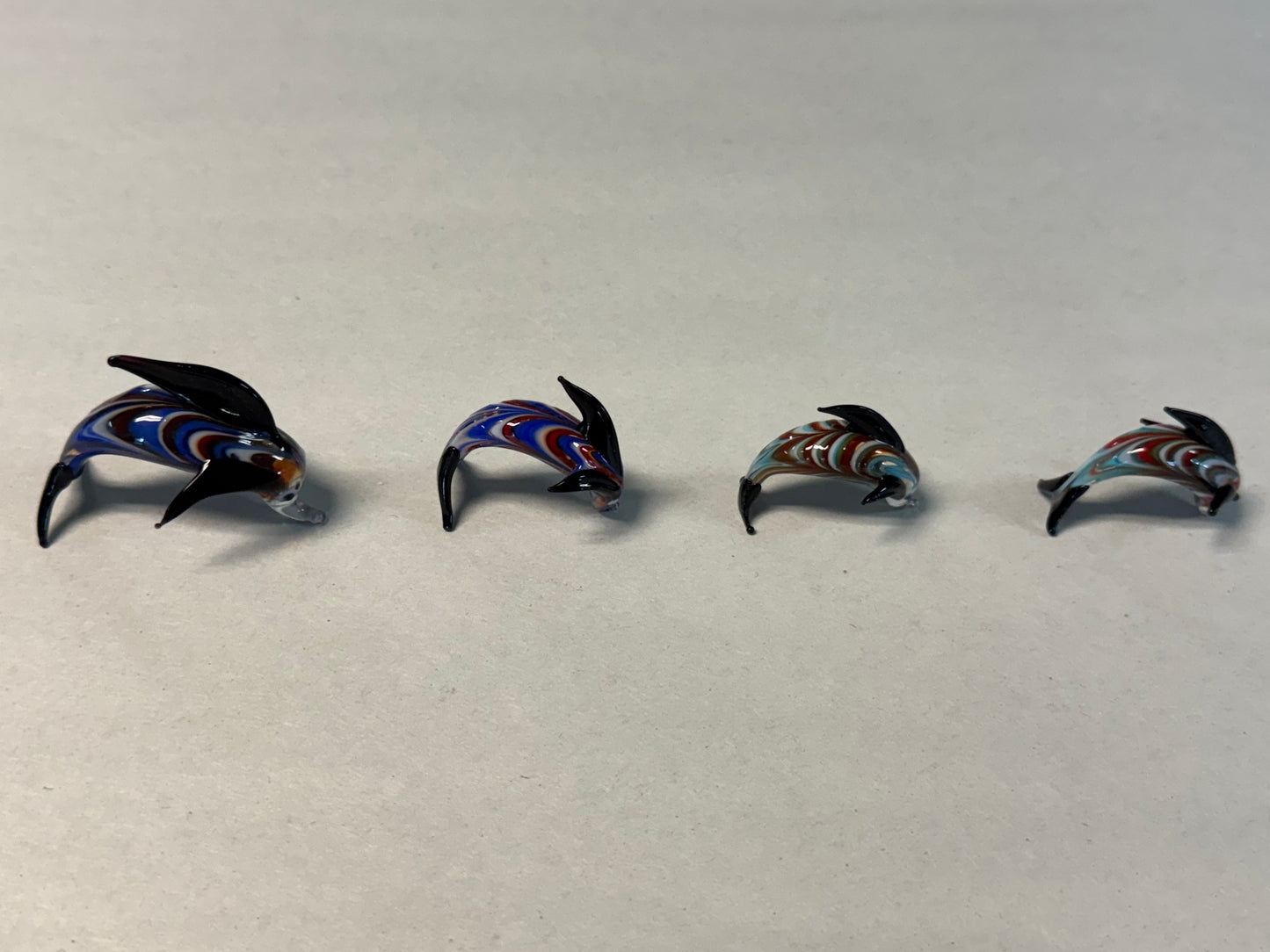 Set of Four Hand-Blown Miniature Art Glass Dolphins