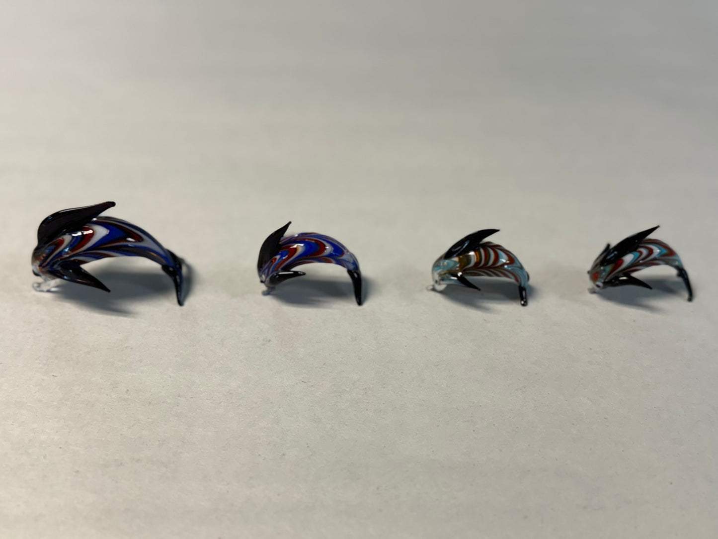Set of Four Hand-Blown Miniature Art Glass Dolphins
