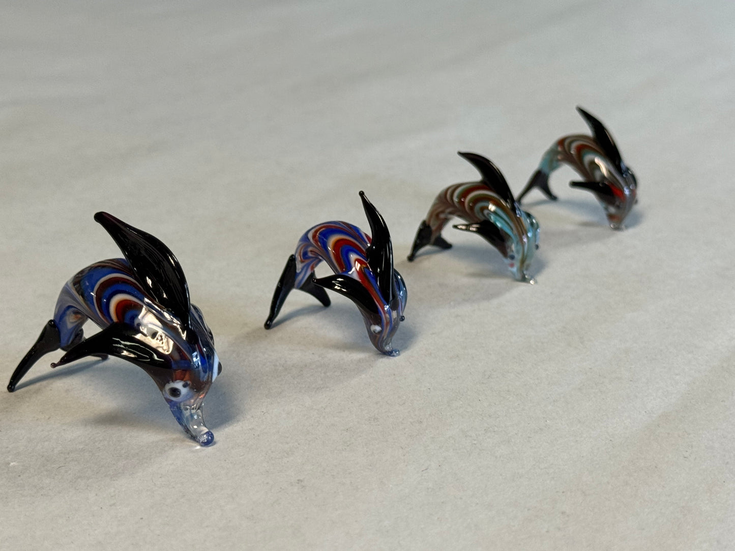 Set of Four Hand-Blown Miniature Art Glass Dolphins